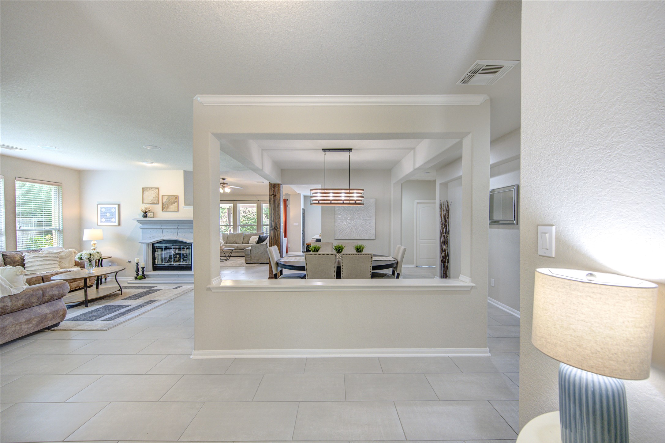 20026 Mellishaw Court Spring, TX 77379 - Photo 6 of 49 a large living room with fireplace furniture and a large window