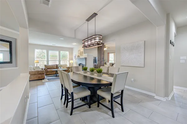 a kitchen with kitchen island a sink stove and cabinets