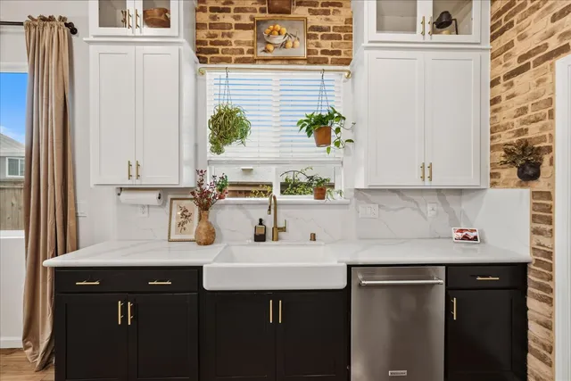 a kitchen with a counter space cabinets and wooden floor