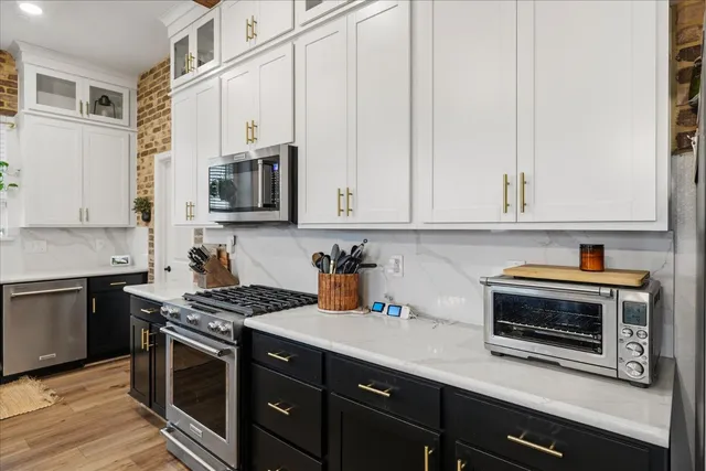 a table with wine bottles and glasses on it