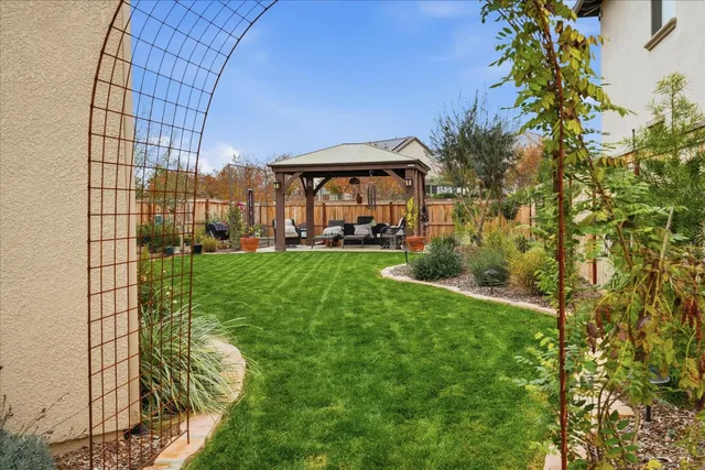 a view of a backyard with seating area