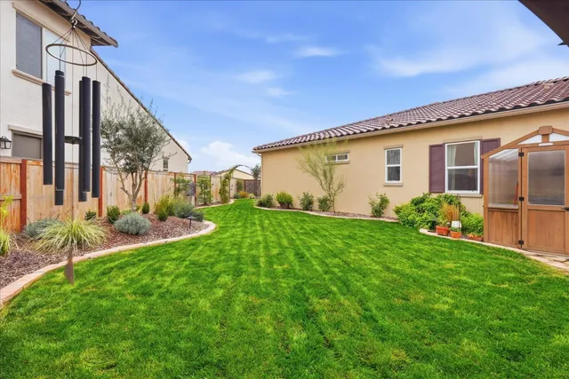 a view of a house with a snow in the yard