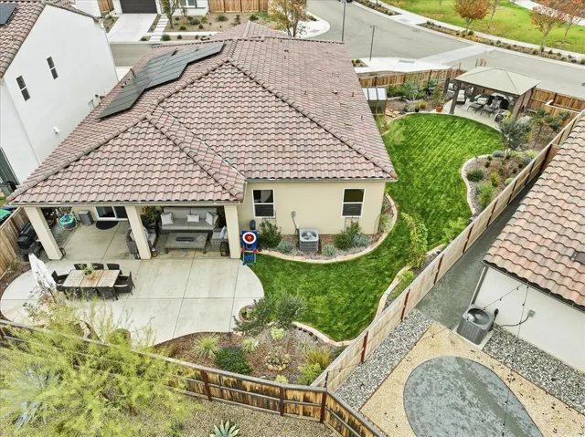 an aerial view of residential houses with outdoor space