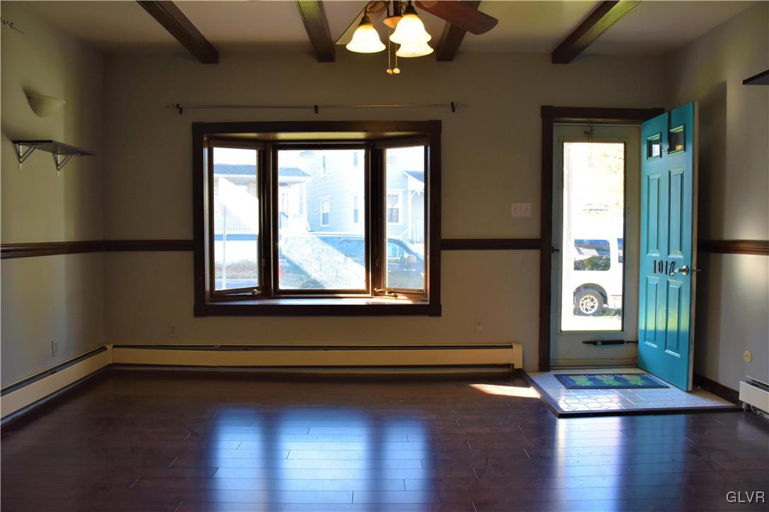 1017 Howertown Road Catasauqua, PA 18032 - Photo 2 of 15 a view of an empty room with wooden floor and a window