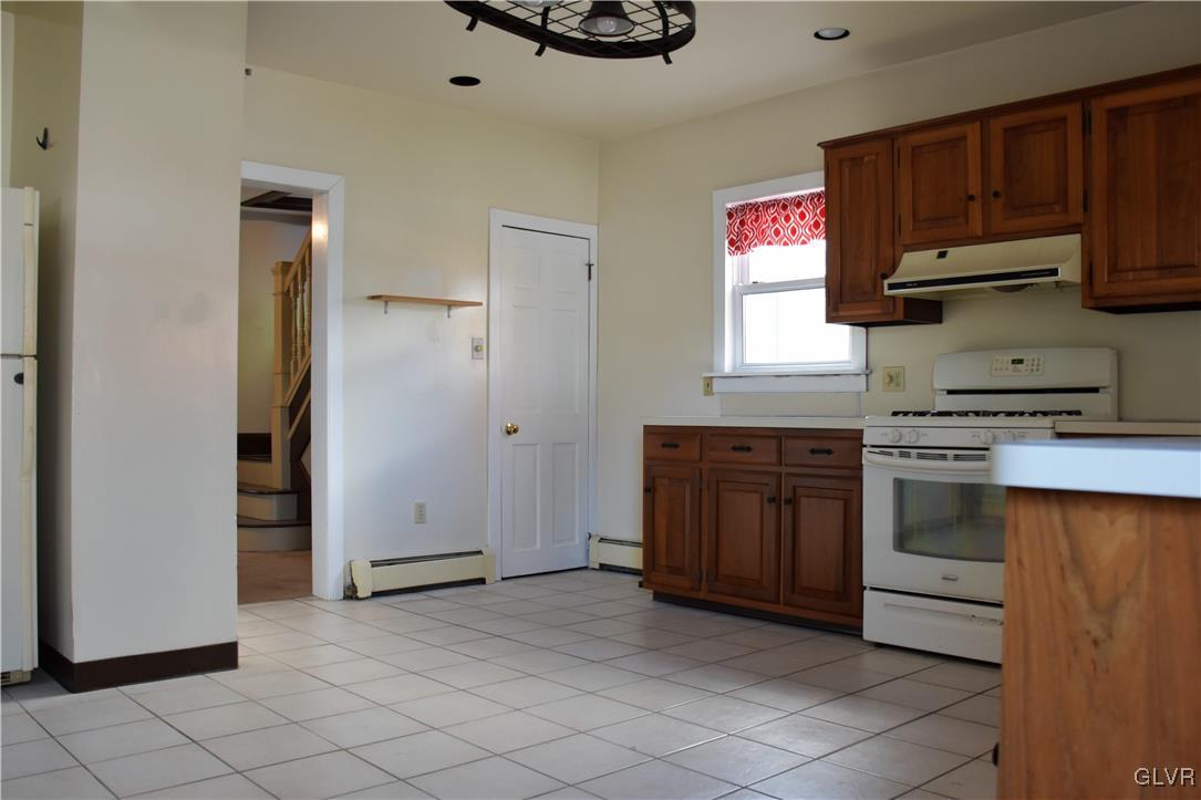 1017 Howertown Road Catasauqua, PA 18032 - Photo 5 of 15 a kitchen with a stove and a microwave