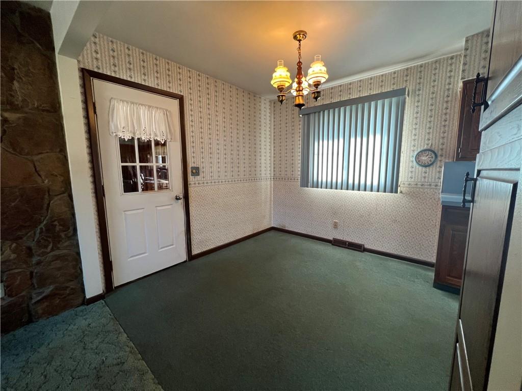 136 Seneca Way New Castle, PA 16102 - Photo 9 of 15 a view of an empty room with a fireplace