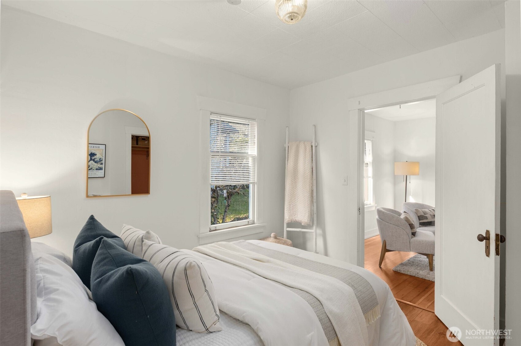 619 Northwest 89th Street Seattle, WA 98117 - Photo 13 of 24 a bedroom with a bed and a window