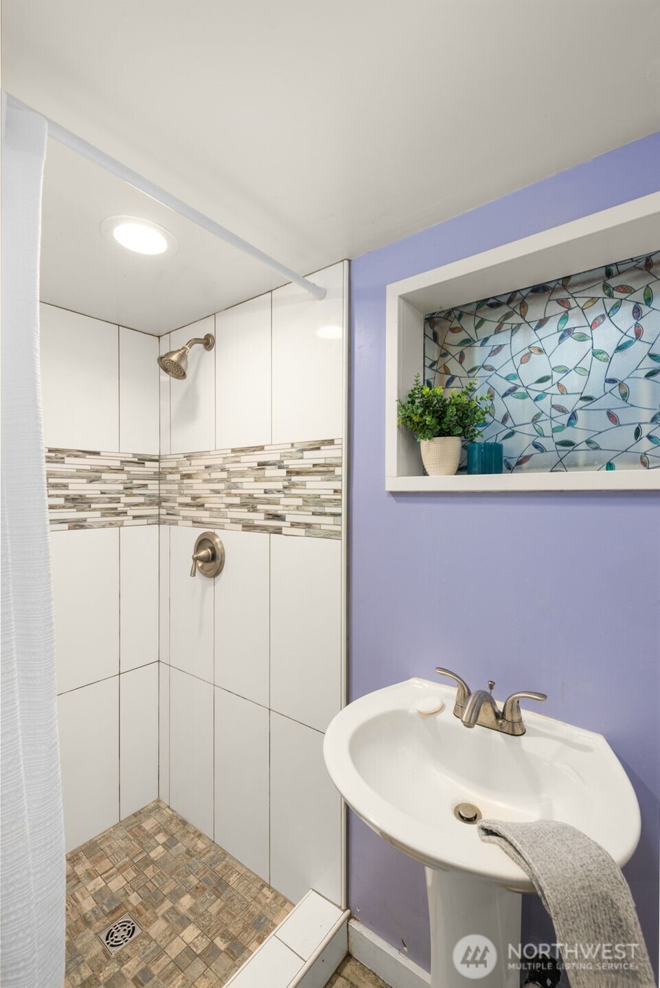 619 Northwest 89th Street Seattle, WA 98117 - Photo 18 of 24 a bathroom with a sink and a mirror