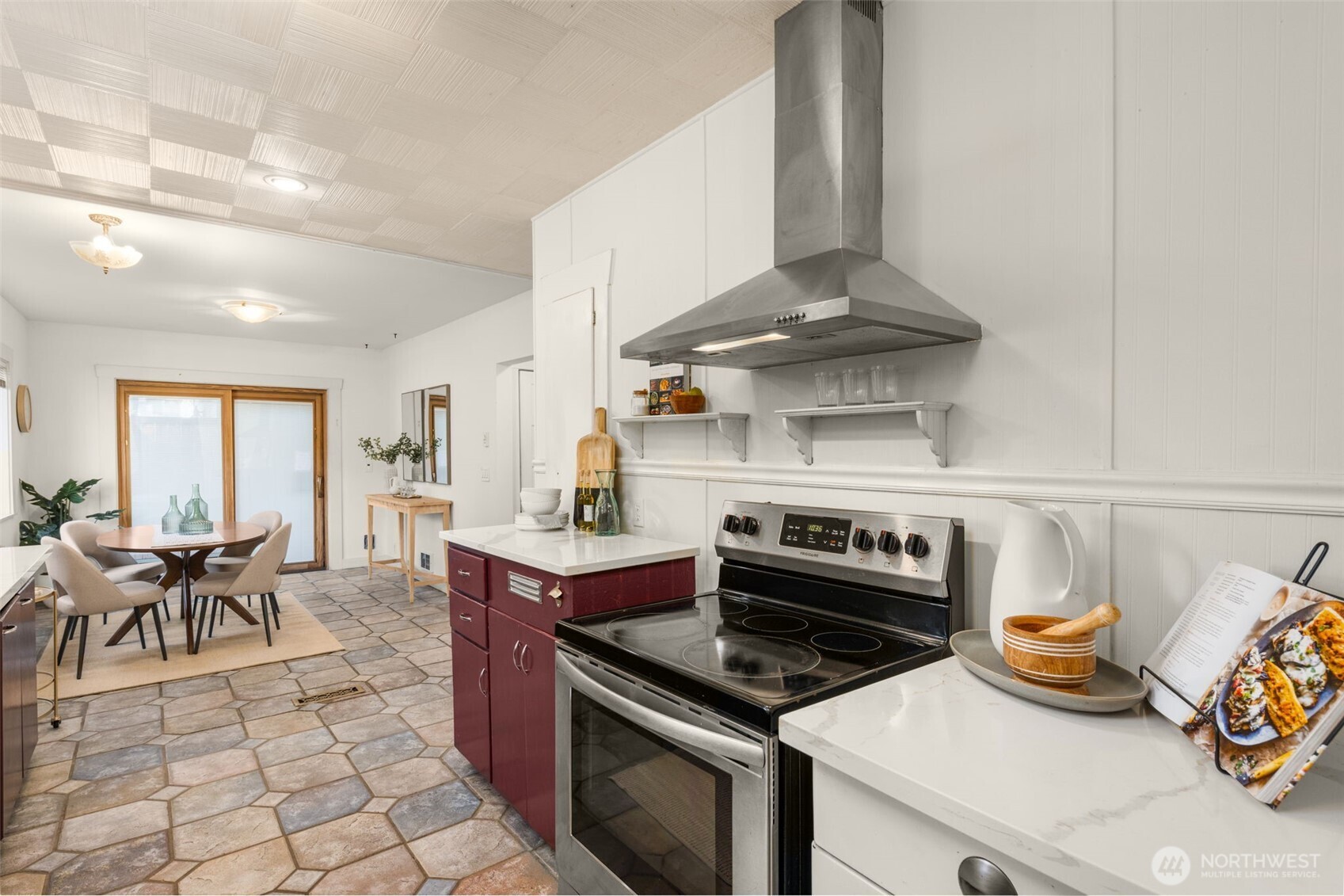 619 Northwest 89th Street Seattle, WA 98117 - Photo 7 of 24 a kitchen with granite countertop a stove and a sink