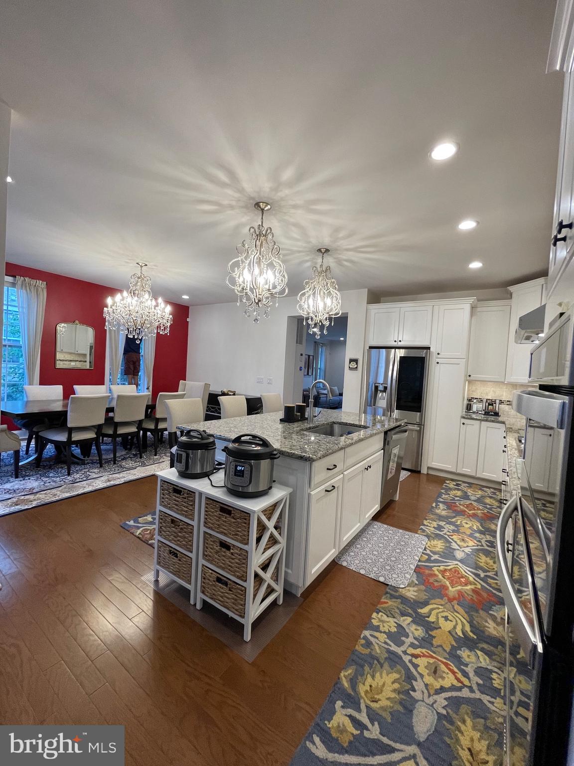 17 Peacock Way Princeton, NJ 08540 - Photo 14 of 44 a large white kitchen with a large island in the center