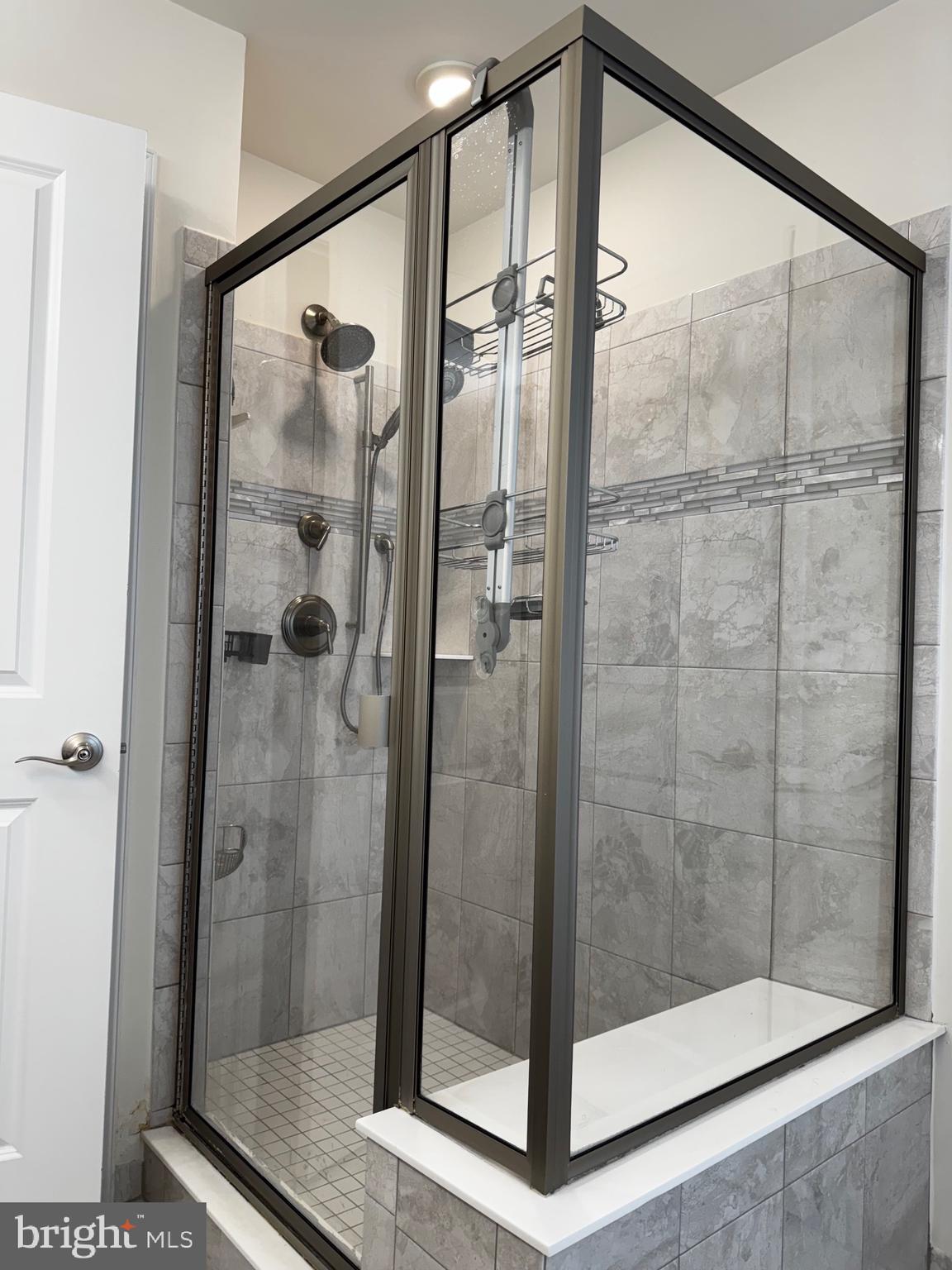 17 Peacock Way Princeton, NJ 08540 - Photo 22 of 44 a bathroom with a glass shower door