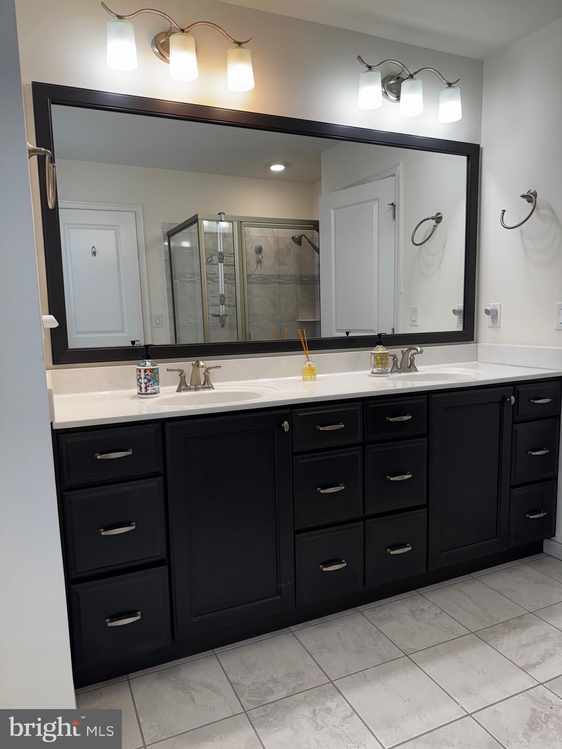 17 Peacock Way Princeton, NJ 08540 - Photo 23 of 44 a bathroom with a granite countertop sink and a mirror