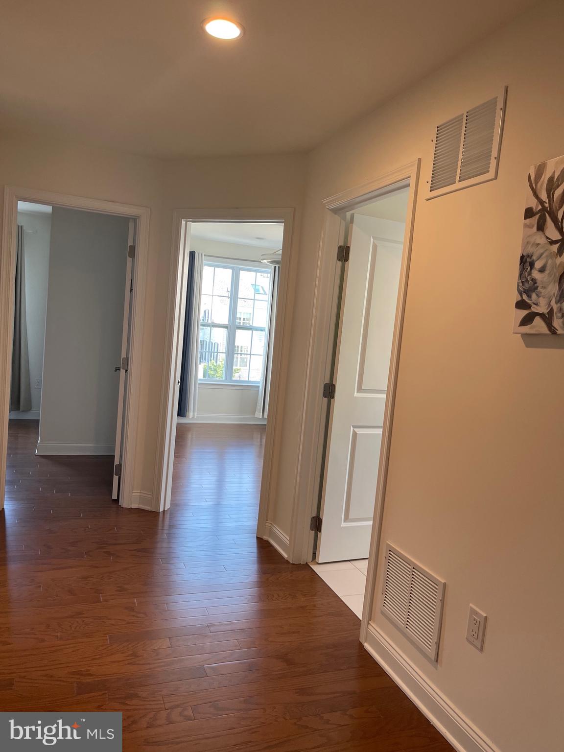 17 Peacock Way Princeton, NJ 08540 - Photo 24 of 44 an empty room with wooden floor and windows