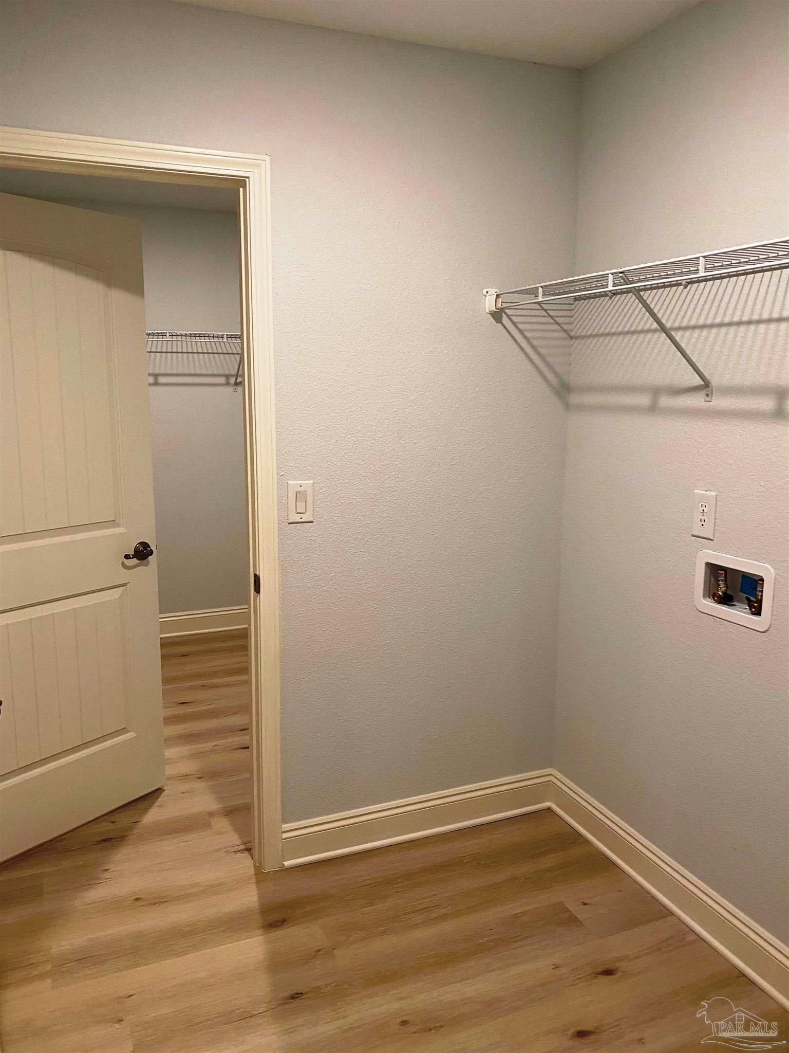5266 South A Jones Road Milton, FL 32583 - Photo 12 of 34 Laundry room leads into master bathroom closet.
