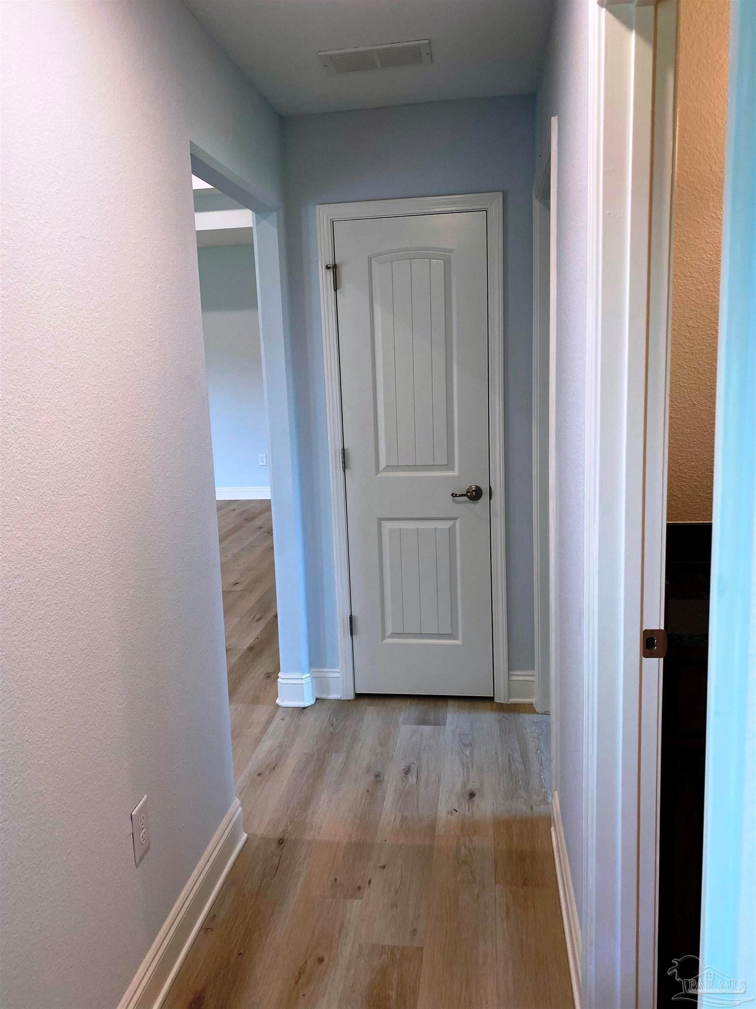 5266 South A Jones Road Milton, FL 32583 - Photo 18 of 34 Rear hall leads to 2 bedrooms/1 bath/patio door.