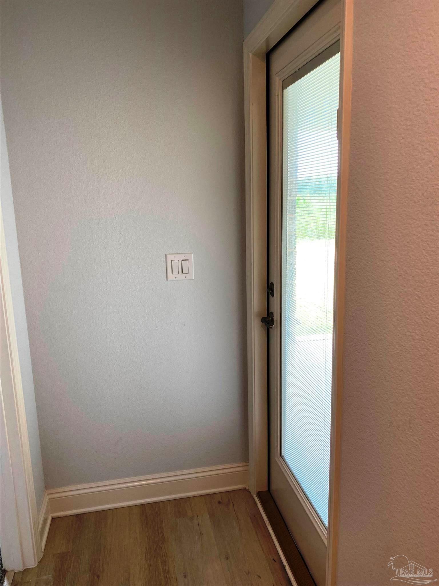 5266 South A Jones Road Milton, FL 32583 - Photo 19 of 34 Rear hall has exit/entry to covered patio.