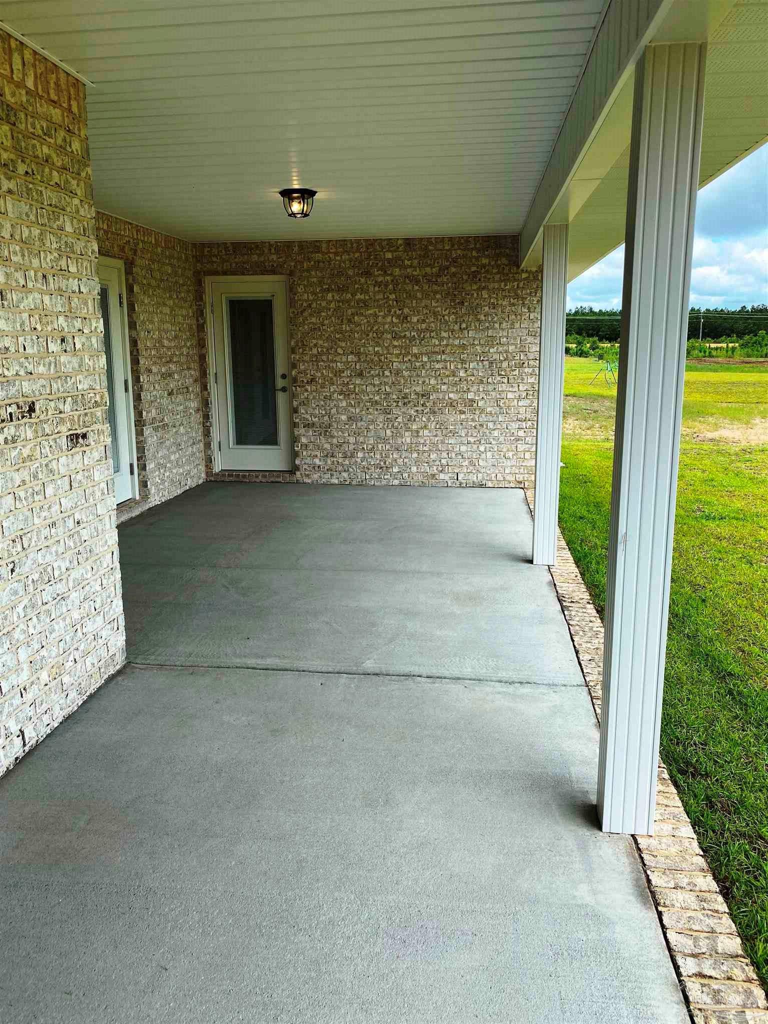 5266 South A Jones Road Milton, FL 32583 - Photo 31 of 34 Master bedroom has private entry/exit to patio.