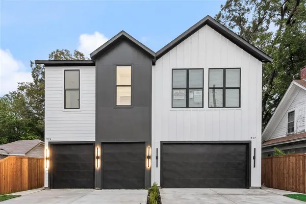 a front view of a house with garage