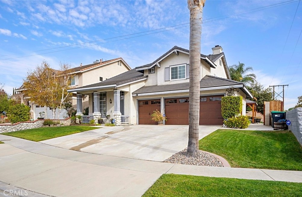14903 Manor Court Chino Hills, CA 91709 - Photo 1 of 15 a front view of a house with a yard table and chairs
