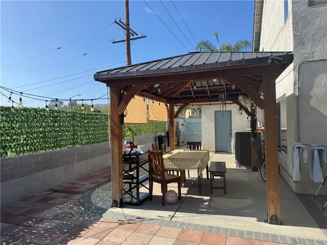a patio with table and chairs