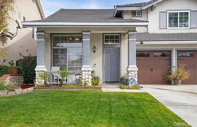 a front view of a house with garden