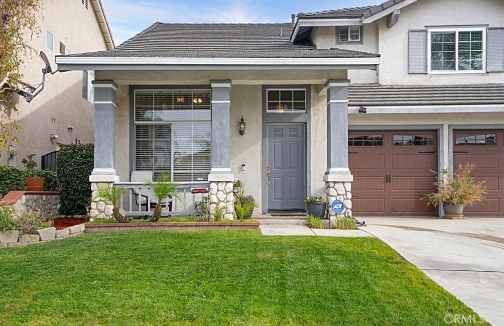 14903 Manor Court Chino Hills, CA 91709 - Photo 2 of 15 a front view of a house with garden