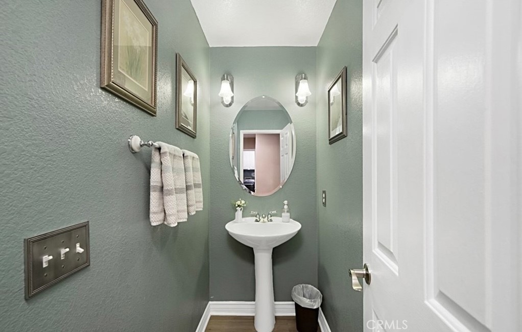 14903 Manor Court Chino Hills, CA 91709 - Photo 4 of 15 a bathroom with a sink and a mirror
