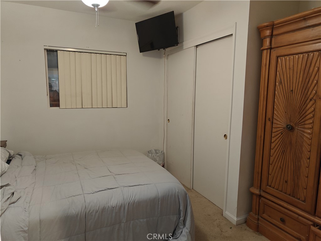 49438 Conejo Road Morongo Valley, CA 92256 - Photo 17 of 18 a bathroom with a toilet and a mirror