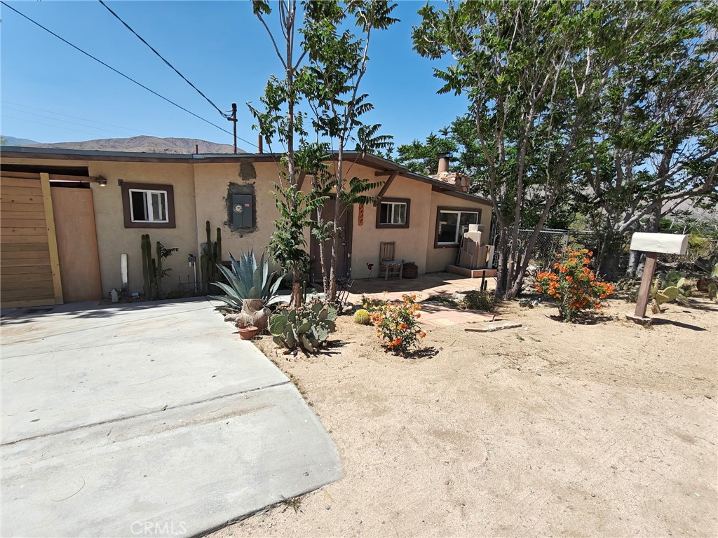 49438 Conejo Road Morongo Valley, CA 92256 - Photo 3 of 18 a view of a house with snow on the floor