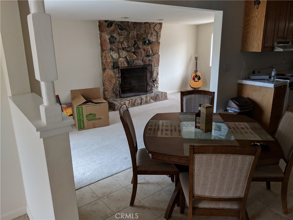 49438 Conejo Road Morongo Valley, CA 92256 - Photo 7 of 18 a dining room with furniture and wooden floor