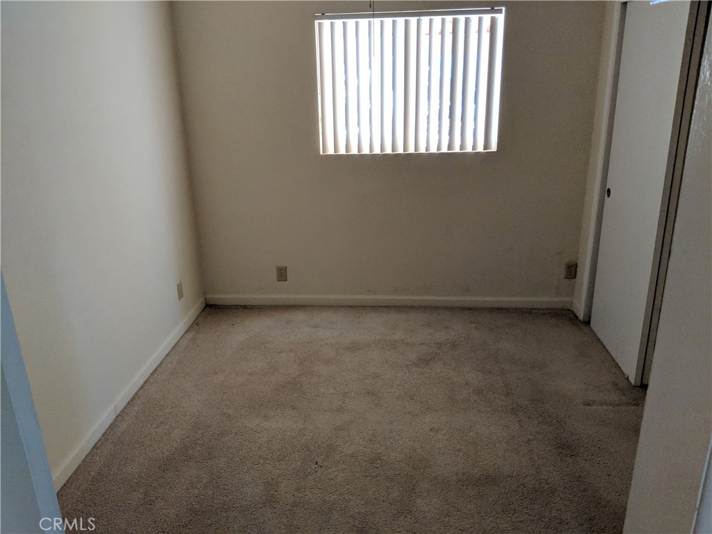 49438 Conejo Road Morongo Valley, CA 92256 - Photo 9 of 18 an empty room with a window