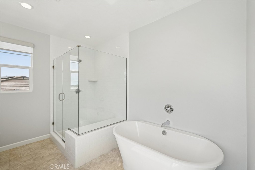 39470 Sagewood Temecula, CA 92591 - Photo 28 of 53 Spa-like bath with tub and glass shower