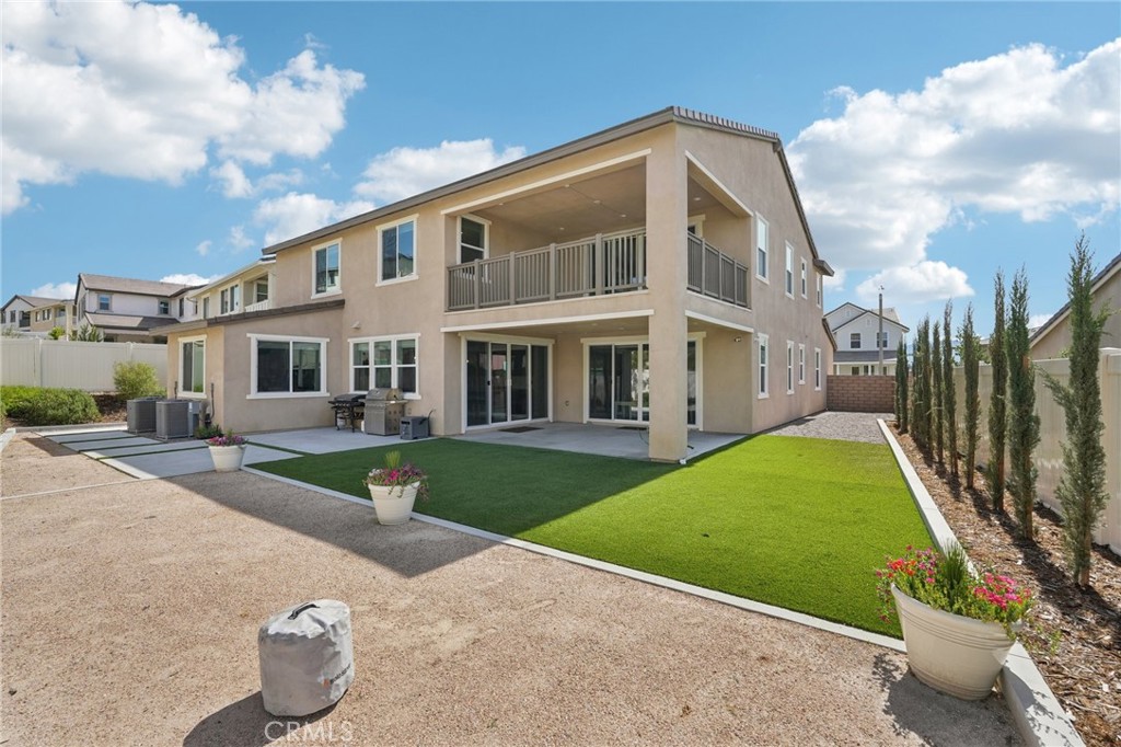 39470 Sagewood Temecula, CA 92591 - Photo 4 of 53 Expansive pool-size backyard with covered patio & balcony