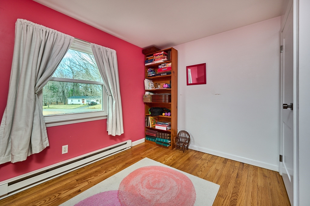 46 Deepwoods Drive Amherst, MA 01002 - Photo 13 of 35 a bed room with a bed and a window