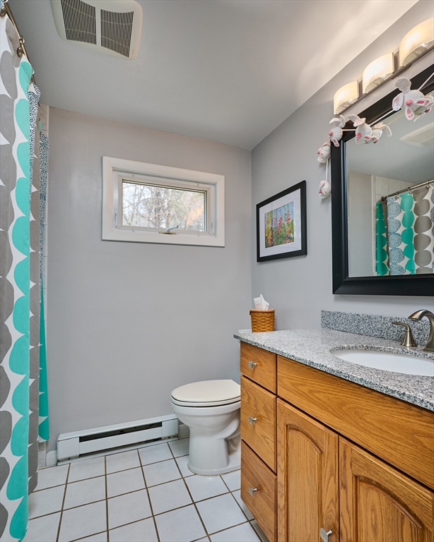 46 Deepwoods Drive Amherst, MA 01002 - Photo 14 of 35 a bathroom with a granite countertop sink toilet and mirror
