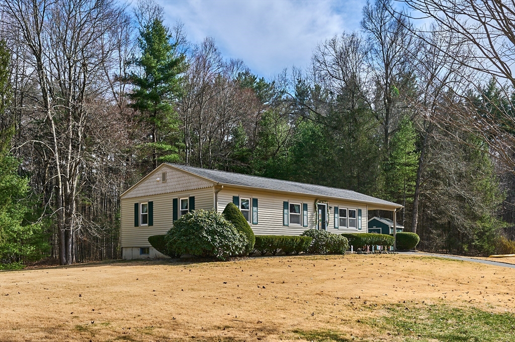 46 Deepwoods Drive Amherst, MA 01002 - Photo 20 of 35 a front view of a house with a yard covered in snow