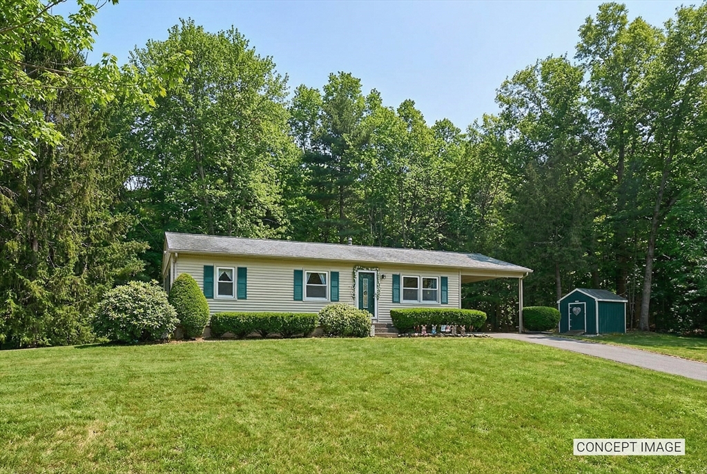 46 Deepwoods Drive Amherst, MA 01002 - Photo 2 of 35 a front view of a house with a yard