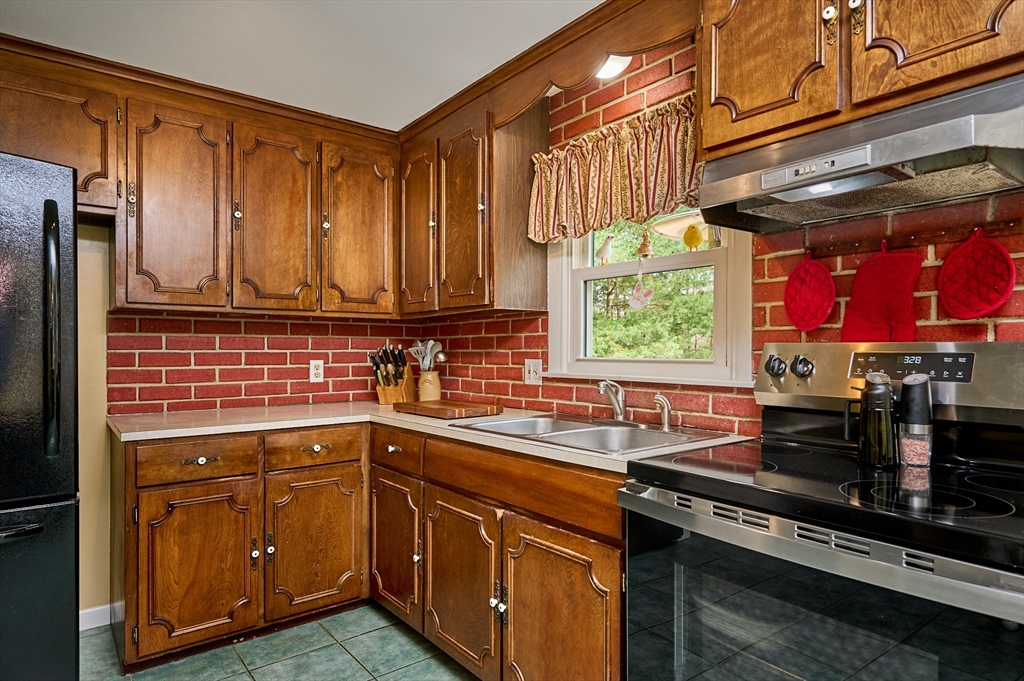 46 Deepwoods Drive Amherst, MA 01002 - Photo 7 of 35 a kitchen with stainless steel appliances granite countertop a sink stove and cabinets