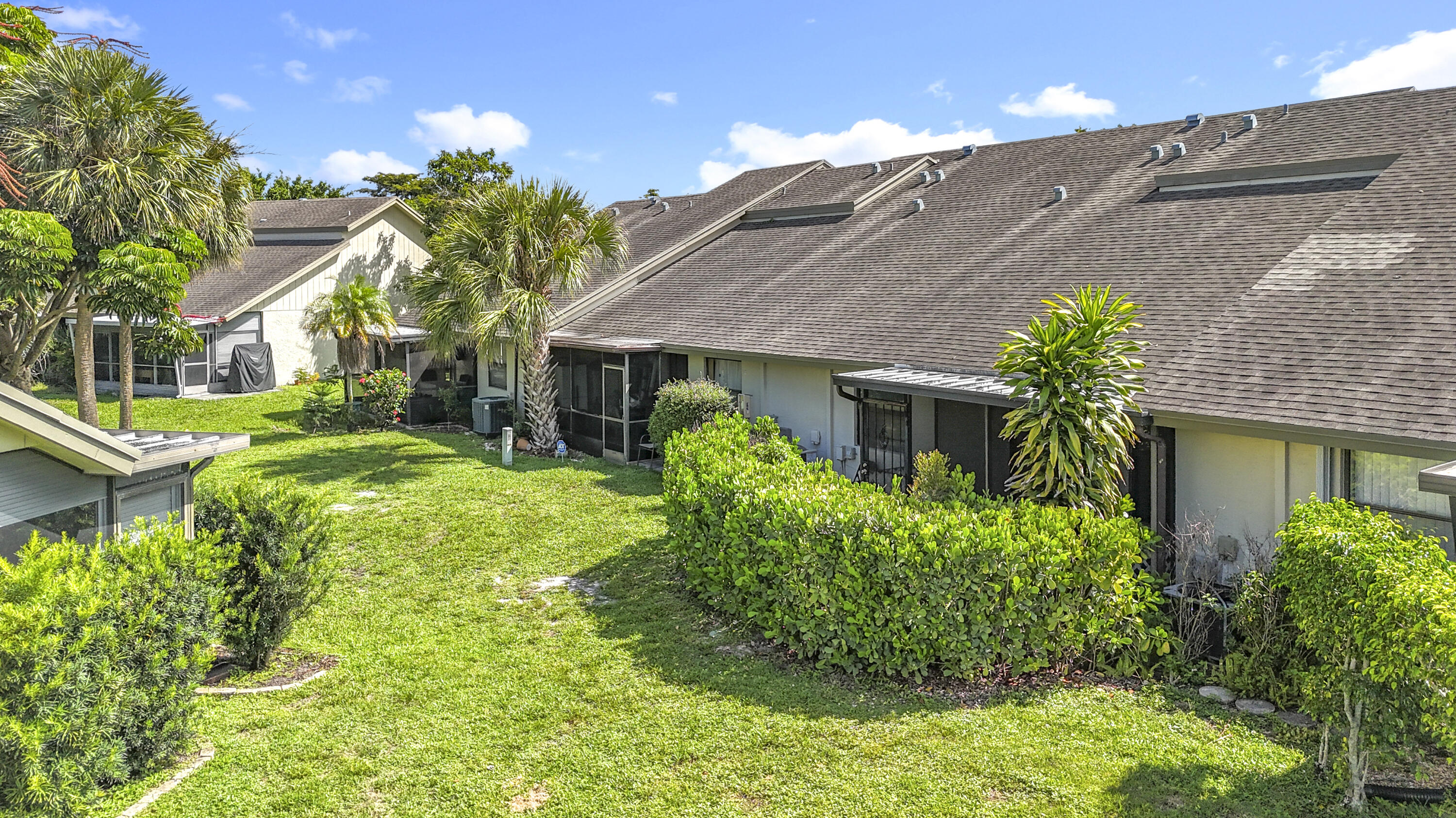 9278 Ketay Circle Boca Raton, FL 33428 - Photo 13 of 55 a front view of a house with garden