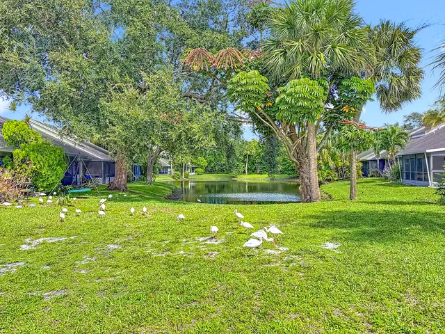 a view of a kitchen with a sink and a window