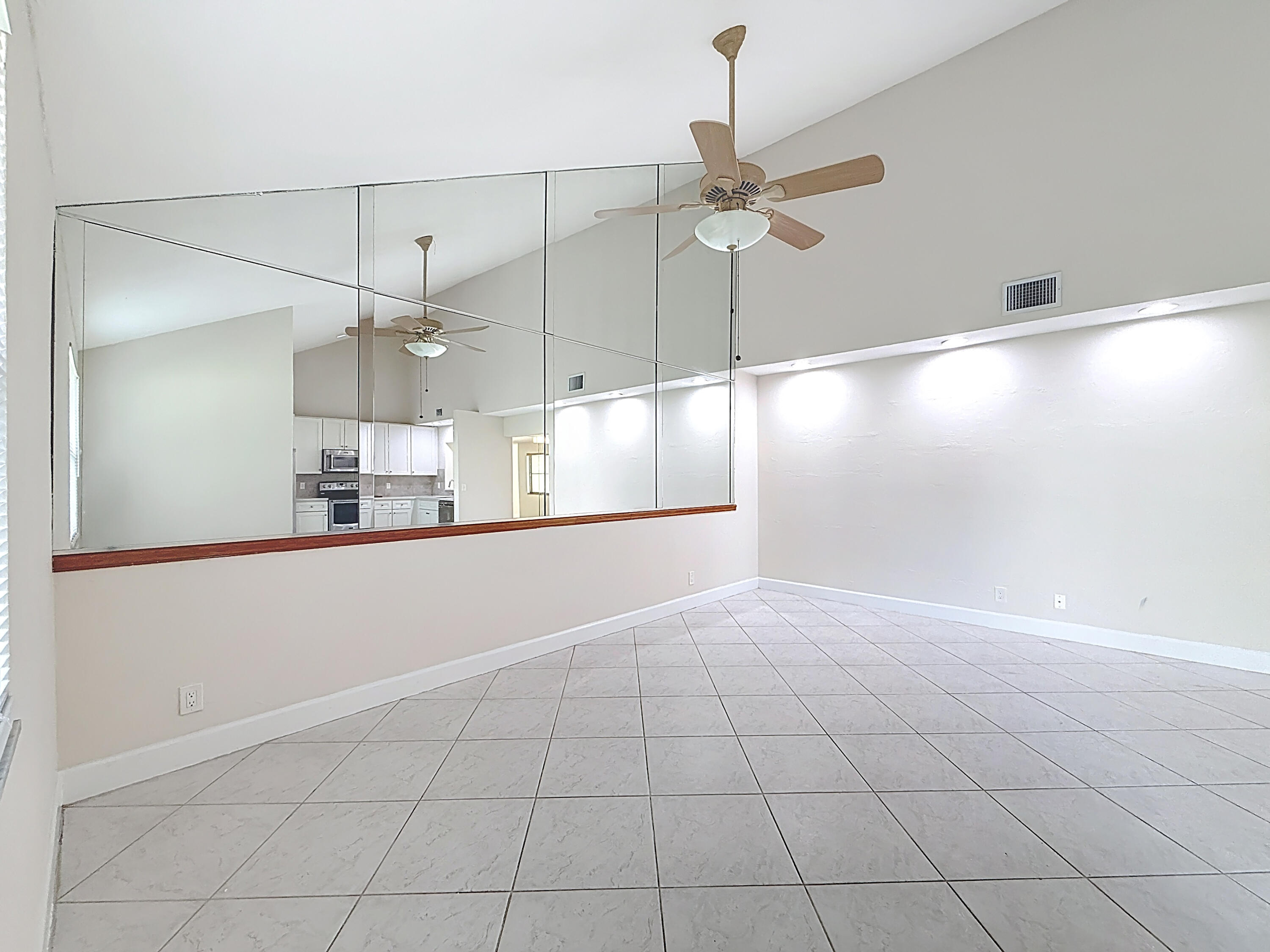 9278 Ketay Circle Boca Raton, FL 33428 - Photo 16 of 55 an empty room with fan and windows