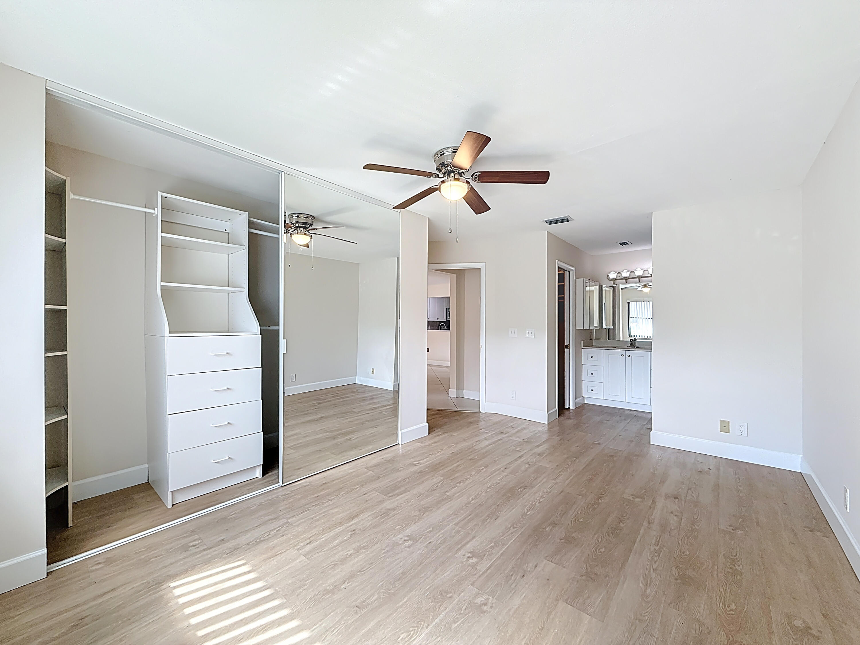 9278 Ketay Circle Boca Raton, FL 33428 - Photo 19 of 55 wooden floor in an empty room with a window