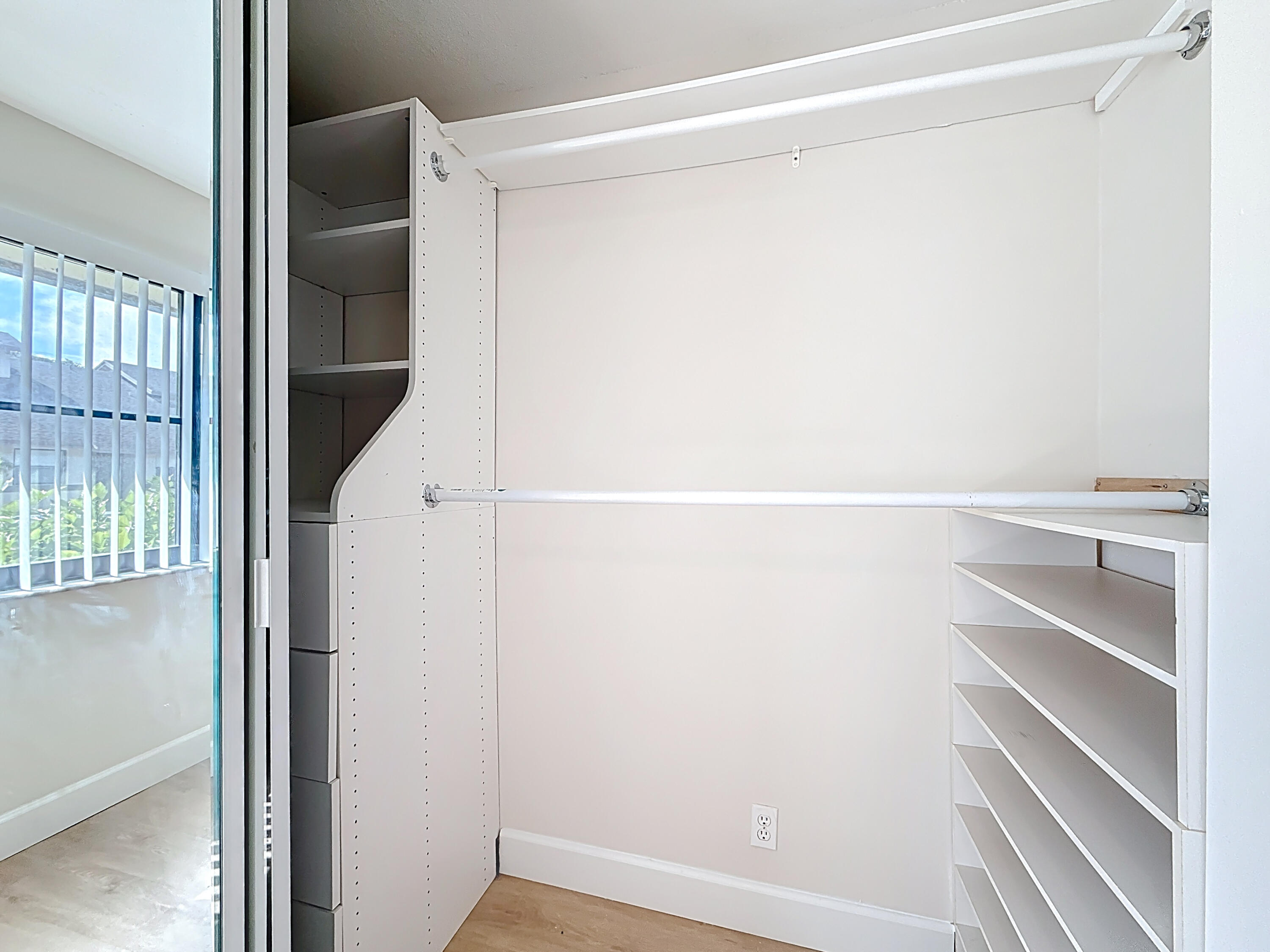 9278 Ketay Circle Boca Raton, FL 33428 - Photo 20 of 55 a view of walk in closet with empty racks