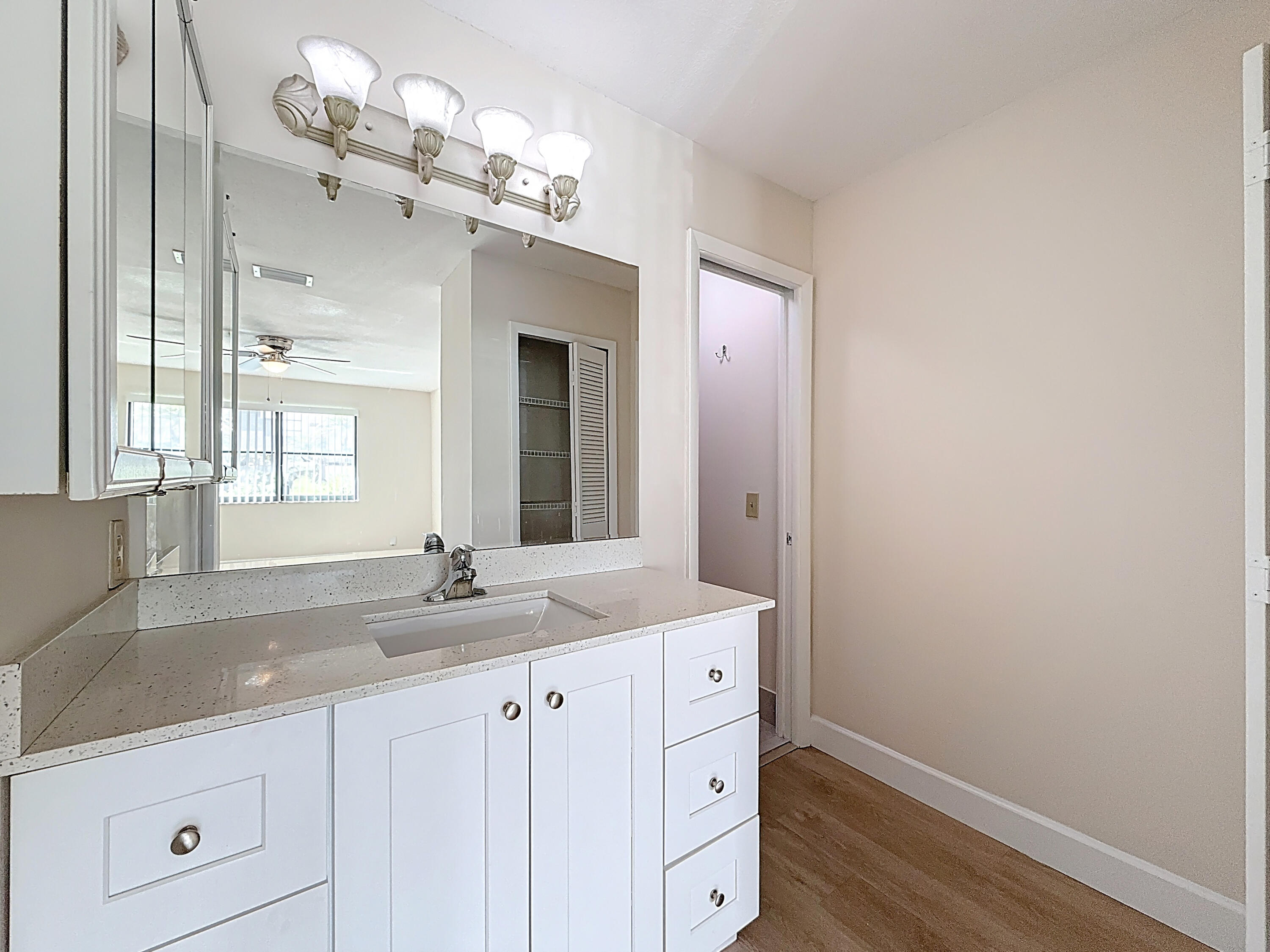 9278 Ketay Circle Boca Raton, FL 33428 - Photo 22 of 55 a bathroom with a sink and a mirror