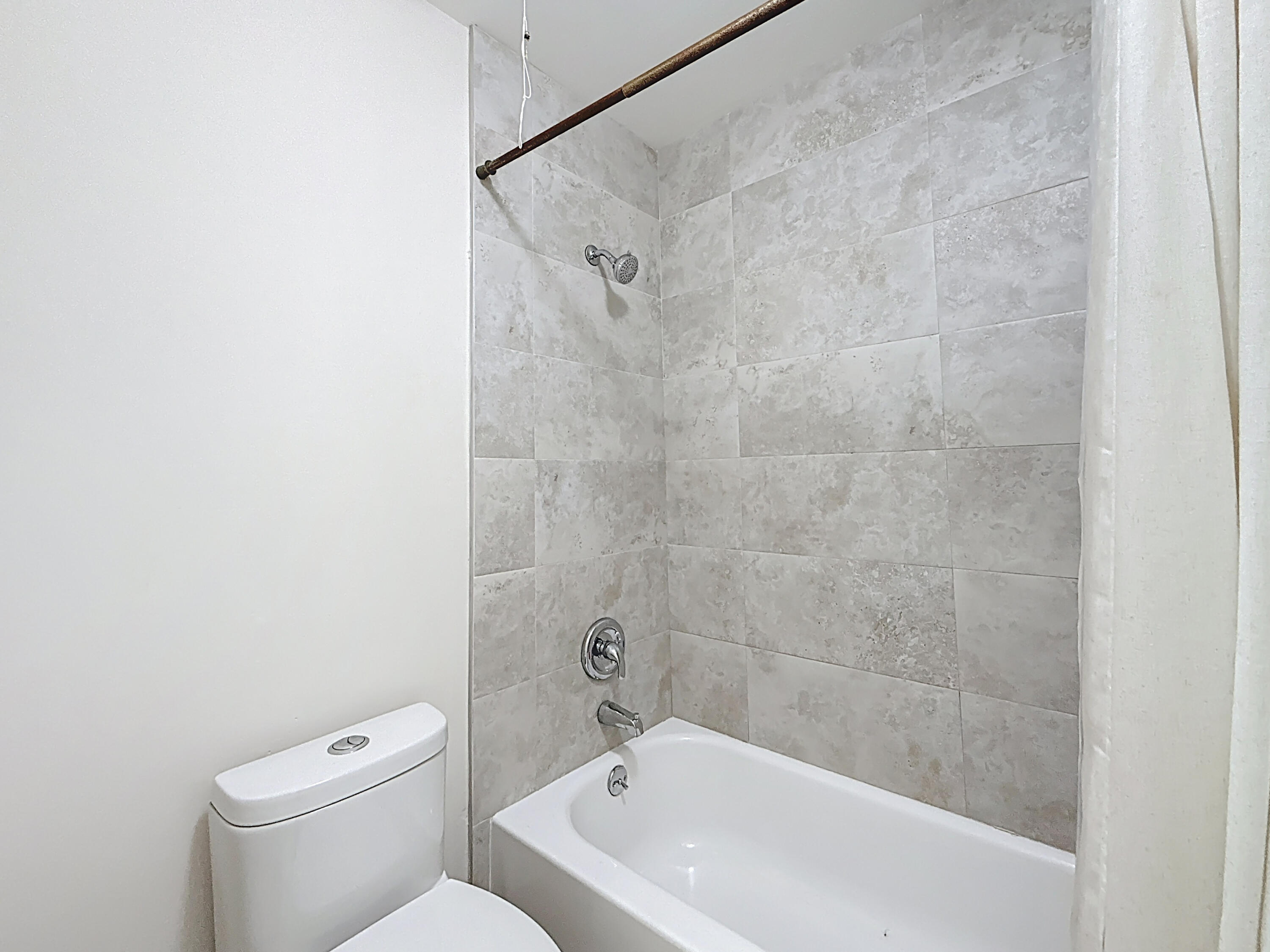 9278 Ketay Circle Boca Raton, FL 33428 - Photo 24 of 55 a bath tub sitting next to a white toilet and a shower