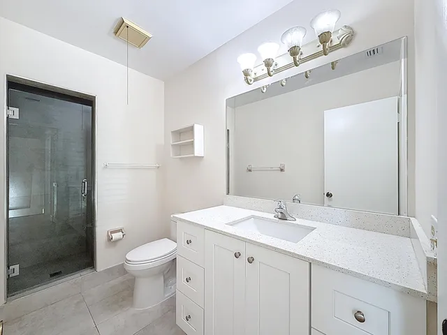 a view of a hallway with entryway wooden floor and windows