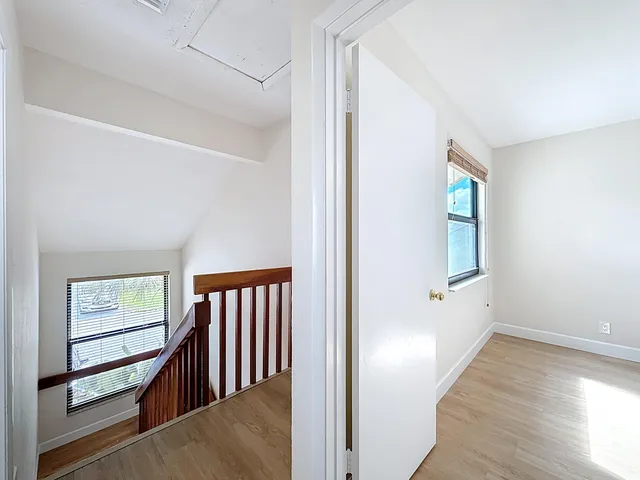a bathroom with a glass shower door