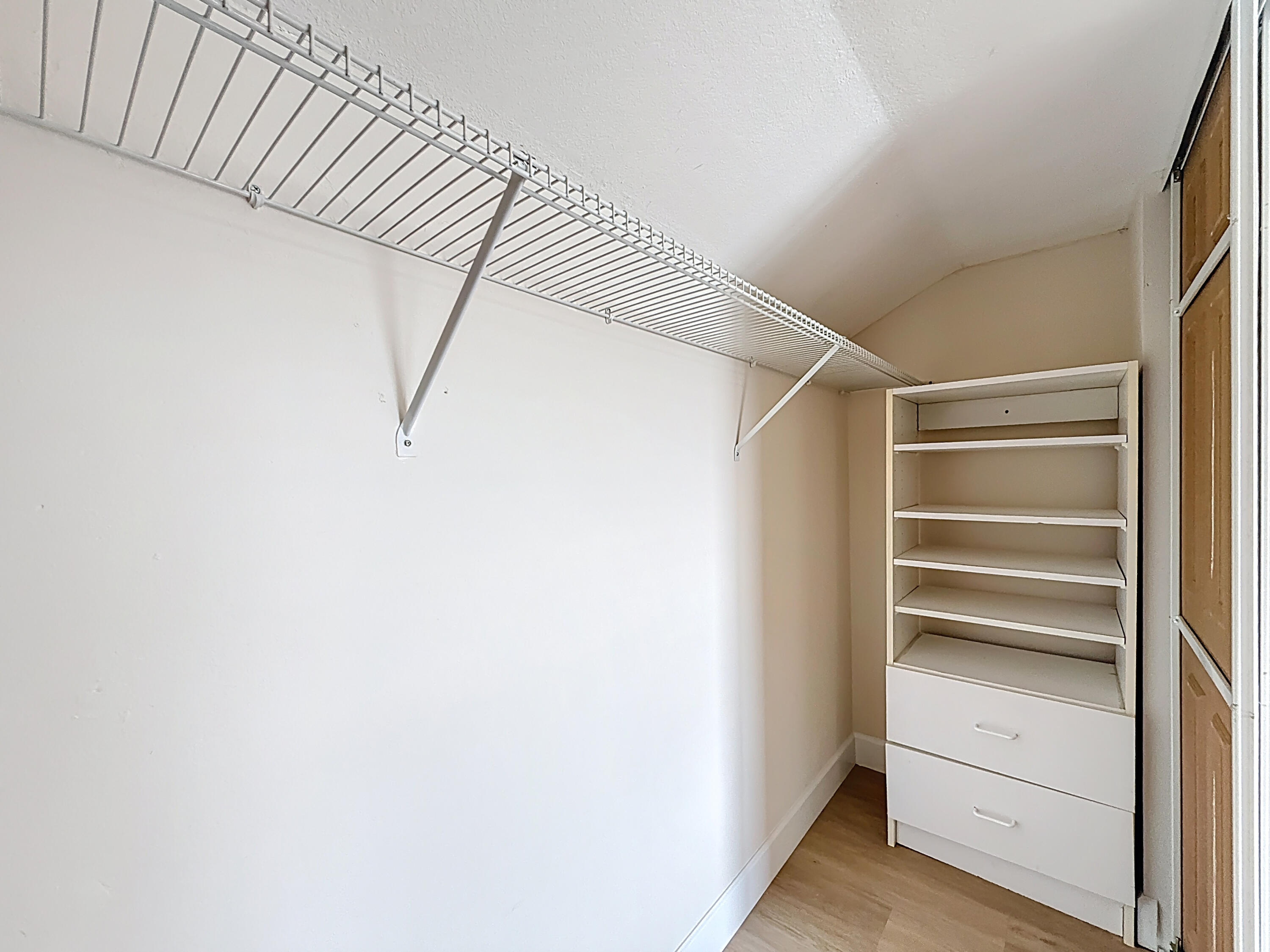 9278 Ketay Circle Boca Raton, FL 33428 - Photo 37 of 55 a view of walk in closet with empty racks
