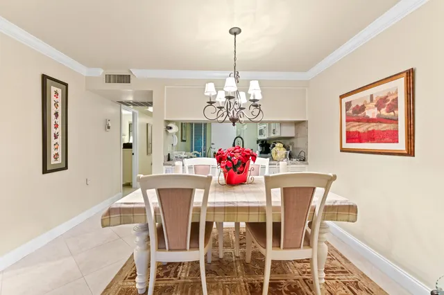a living room with furniture cabinets and a window