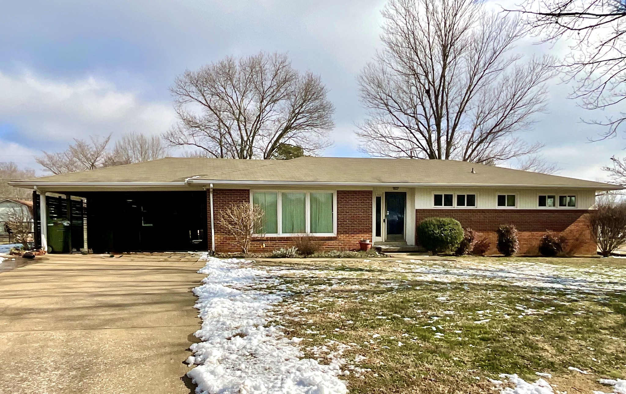 1503 Frances Street Lawrenceburg, TN 38464 - Photo 2 of 44 a front view of a house with a yard outdoor seating and garage